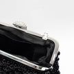 Pochette con perle nere e cristalli con dettagli argentati