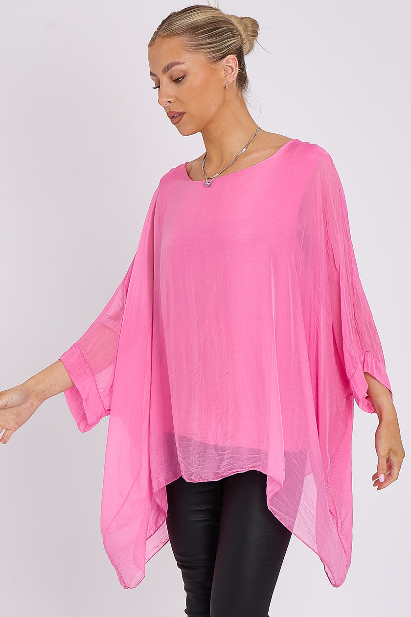 Blusa rosa in seta con maniche a pipistrello