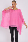 Blusa rosa in seta con maniche a pipistrello