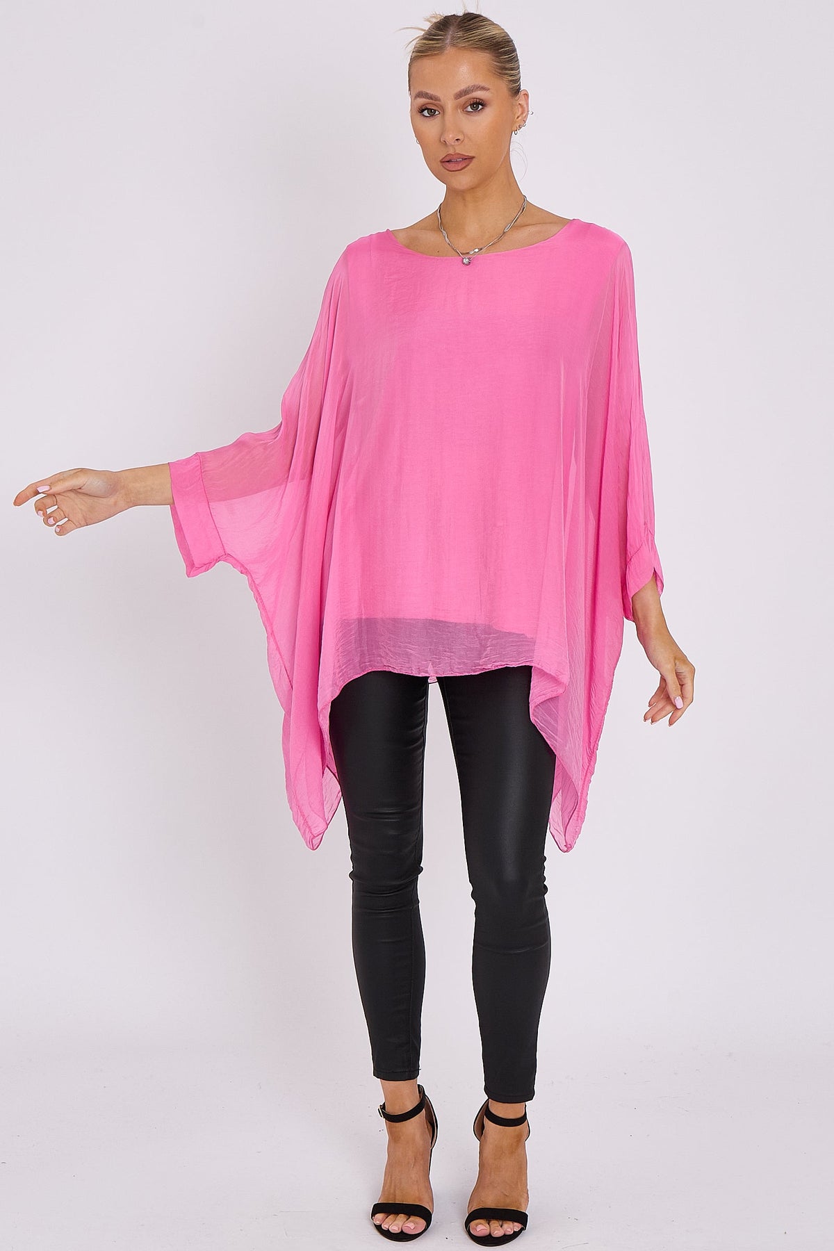 Blusa rosa in seta con maniche a pipistrello