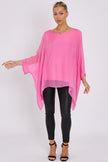 Blusa rosa in seta con maniche a pipistrello