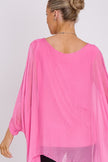Blusa rosa in seta con maniche a pipistrello