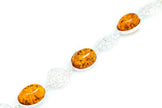 Bracciale a dichiarazione in ambra con filigrana alternata
