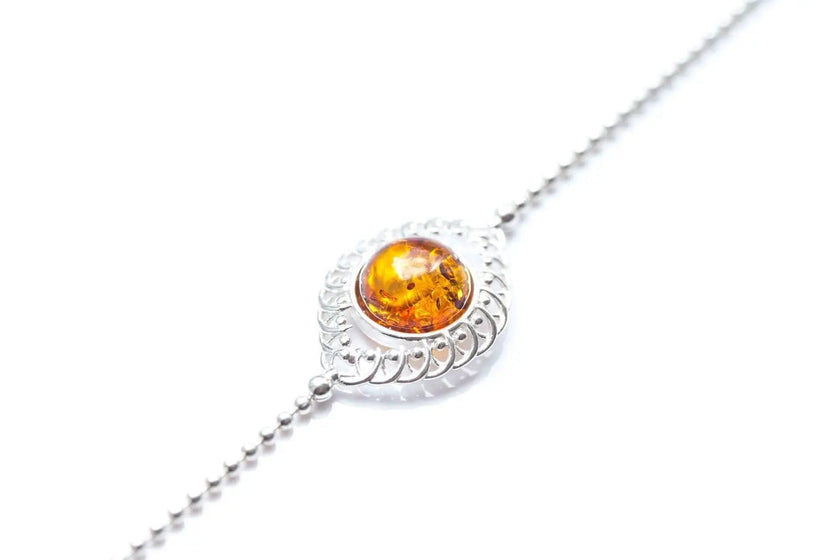 Bracciale decorativo con sfera in ambra e argento