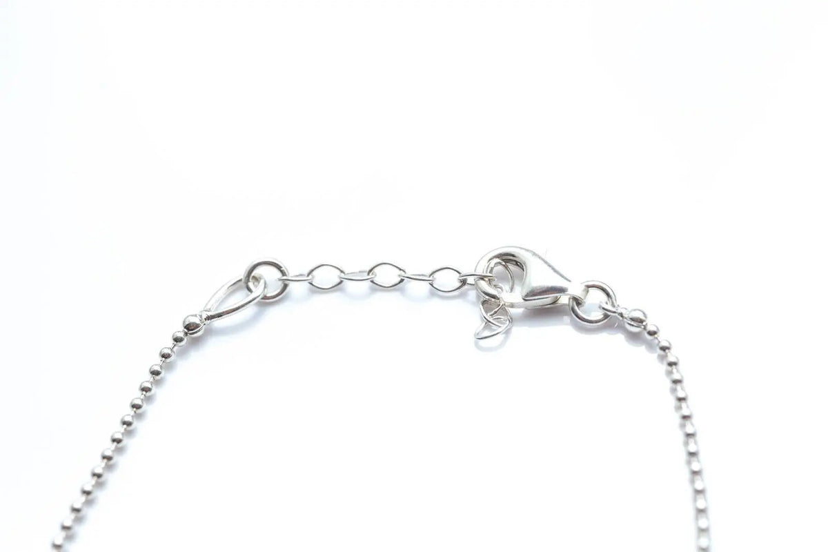 Bracciale decorativo con sfera in ambra e argento