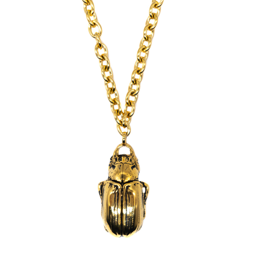 Halsband med guldbagge