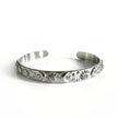 Bracciale rigido Helia Luxe color argento con motivi celestiali