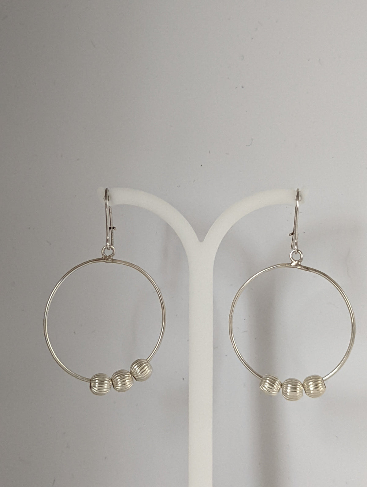 Silver Steed Loop with Buds Dangling Earrings