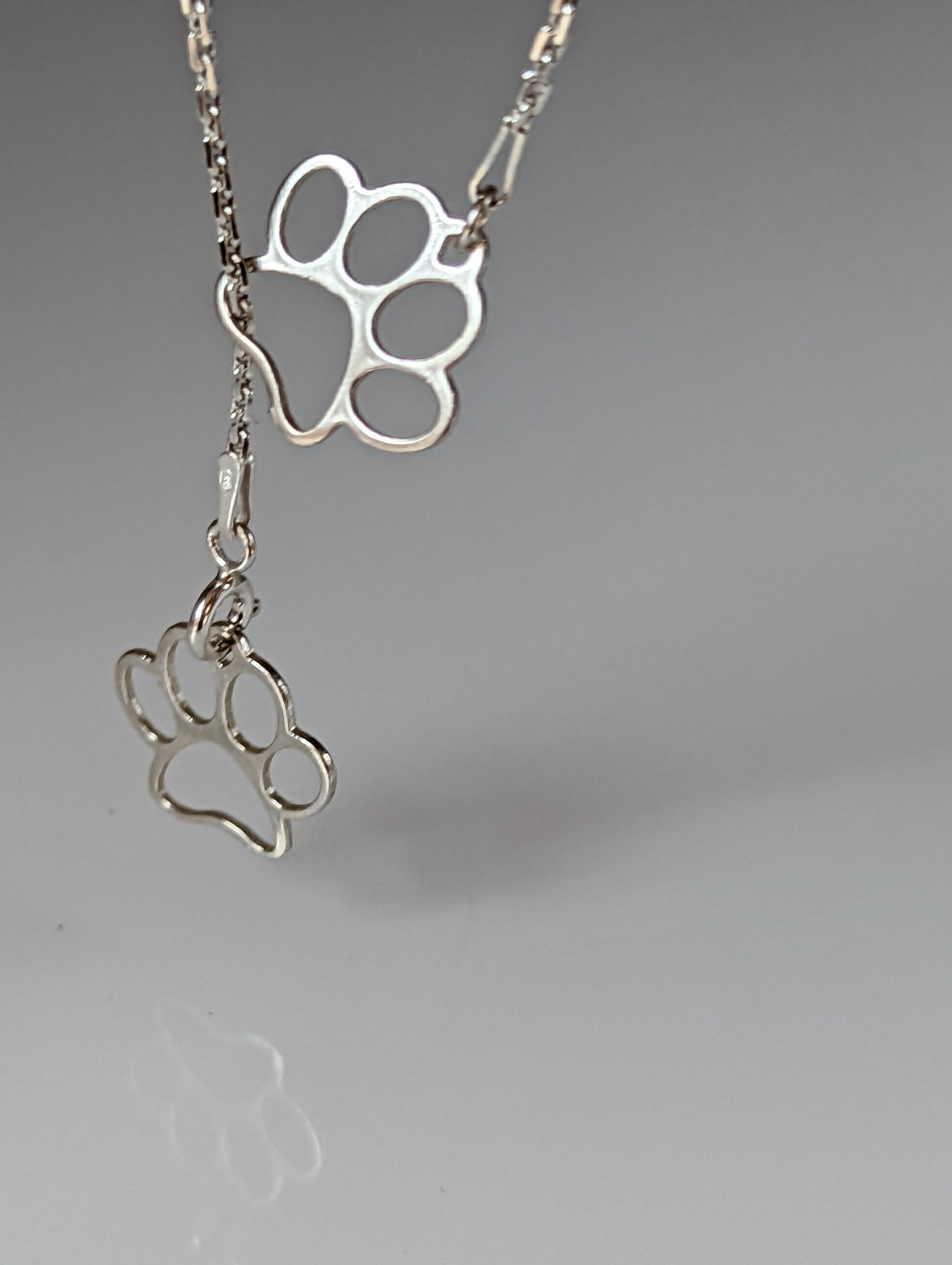 Silver Steed Thread Through Double Paw Print Silver Necklace