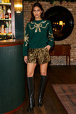 Jersey con escote de lazo y lentejuelas verdes de Yumi