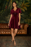 Robe patineuse en velours bordeaux Yumi avec nœud à strass
