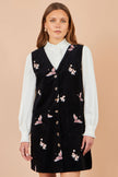 Yumi Schwarzes Pinafore-Kleid mit Kranich-Stickerei und Knopfleiste