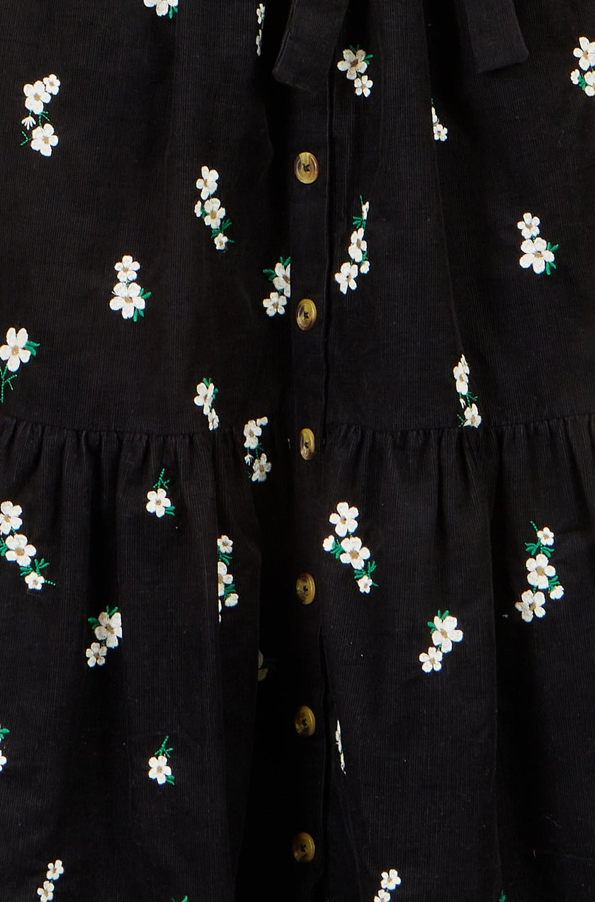 Yumi schwarzes Cordhemdkleid mit Gänseblümchen-Stickerei
