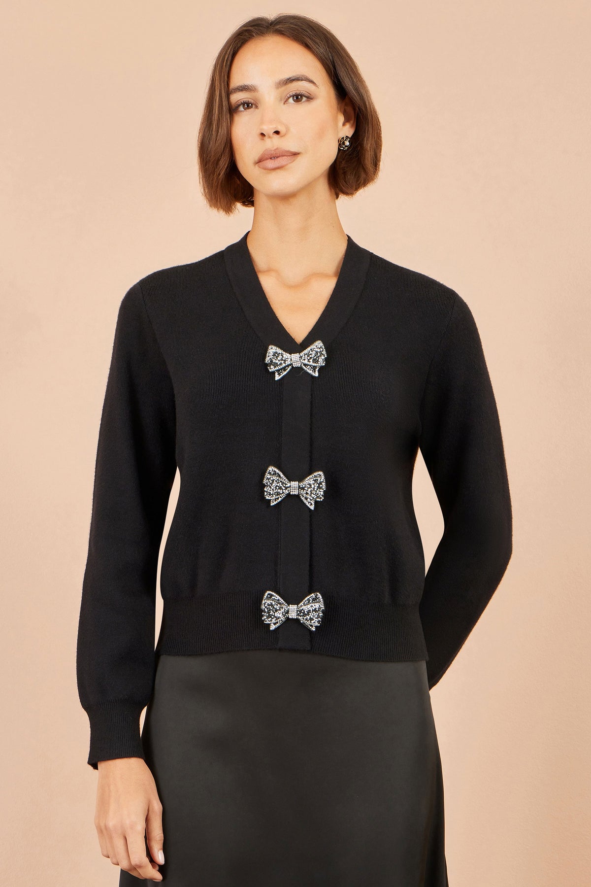 Cardigan Yumi con fiocco nero glitterato