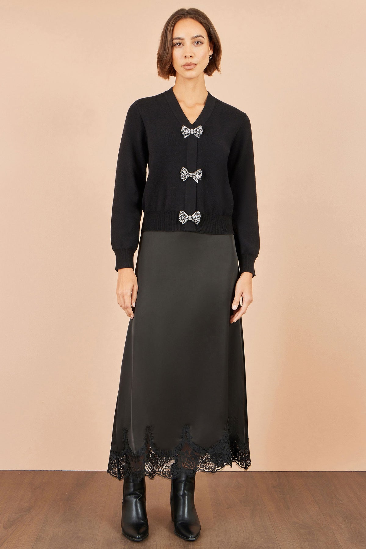 Cardigan Yumi con fiocco nero glitterato