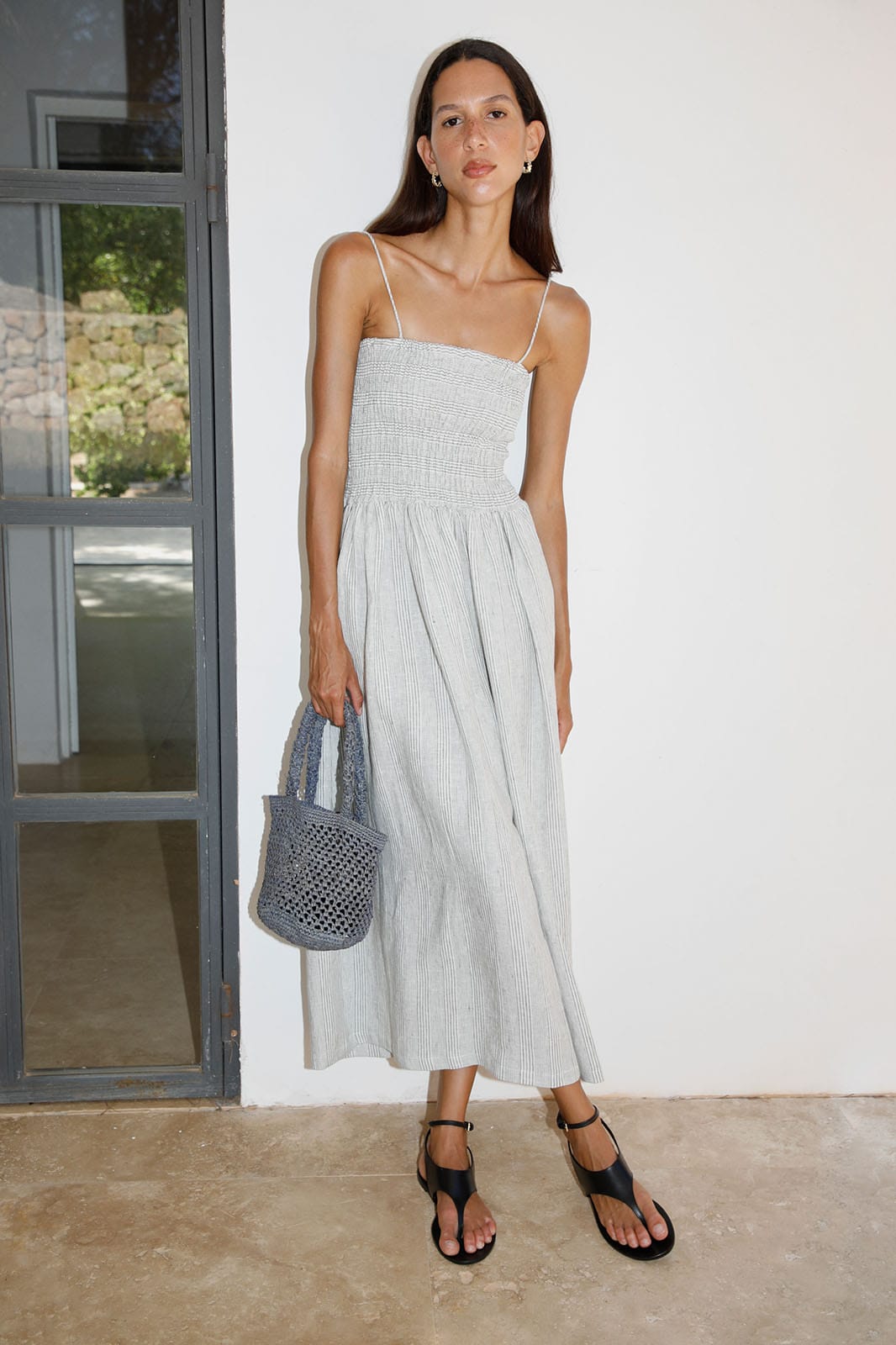 The Harlow Smocked Maxi Dress in striped olive green