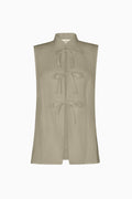 The Alma Stand-Up Collar Tie Vest in oatmeal