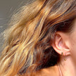 Boucles d'oreilles clous Trio en or avec zircones cubiques noires