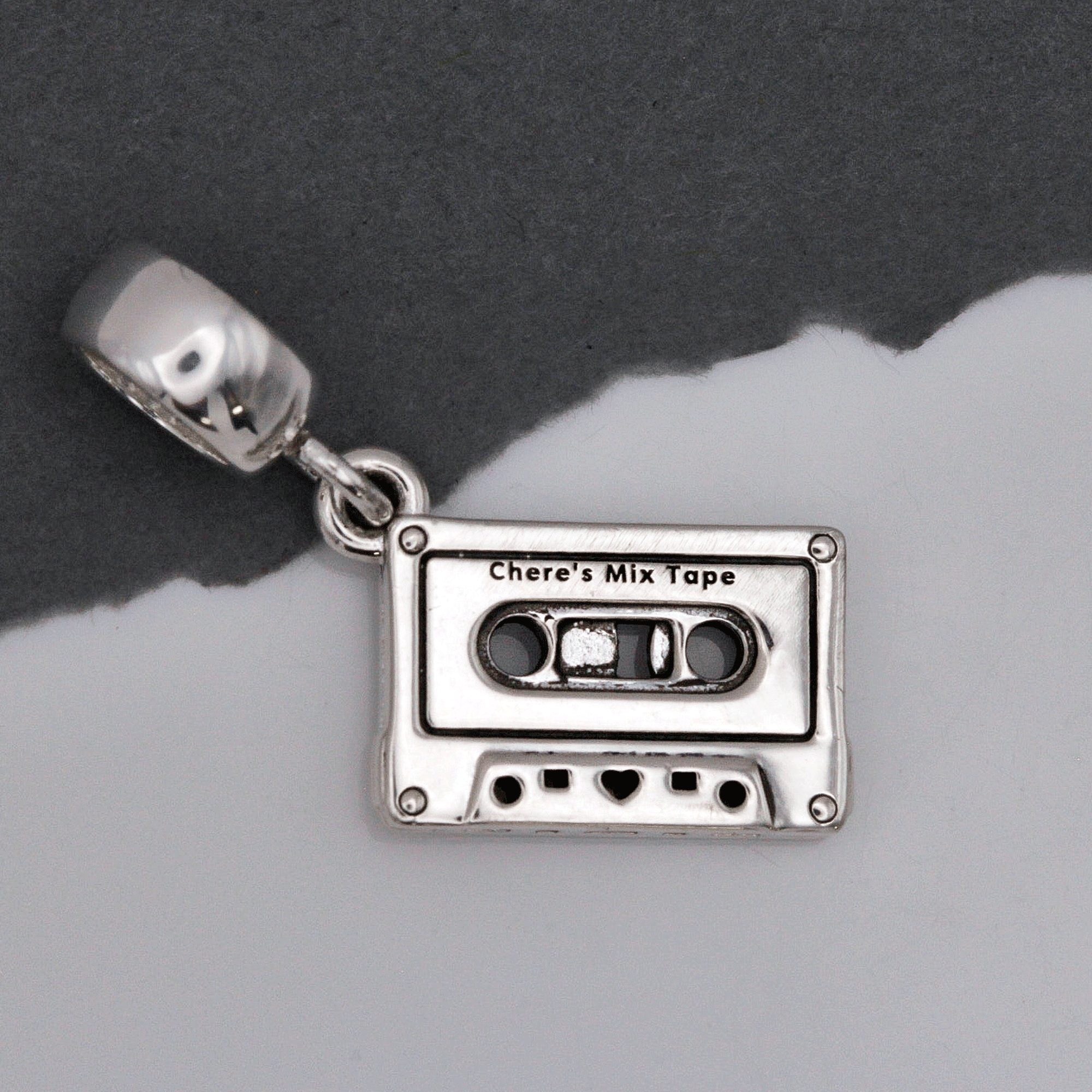 Bedel in de vorm van een cassettebandje