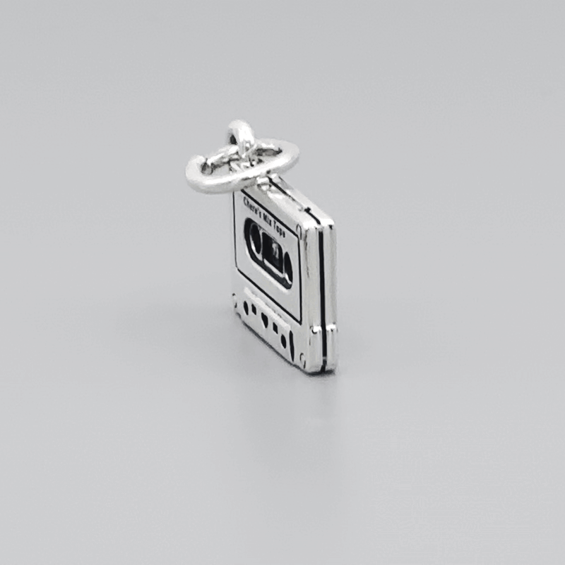 Bedel in de vorm van een cassettebandje