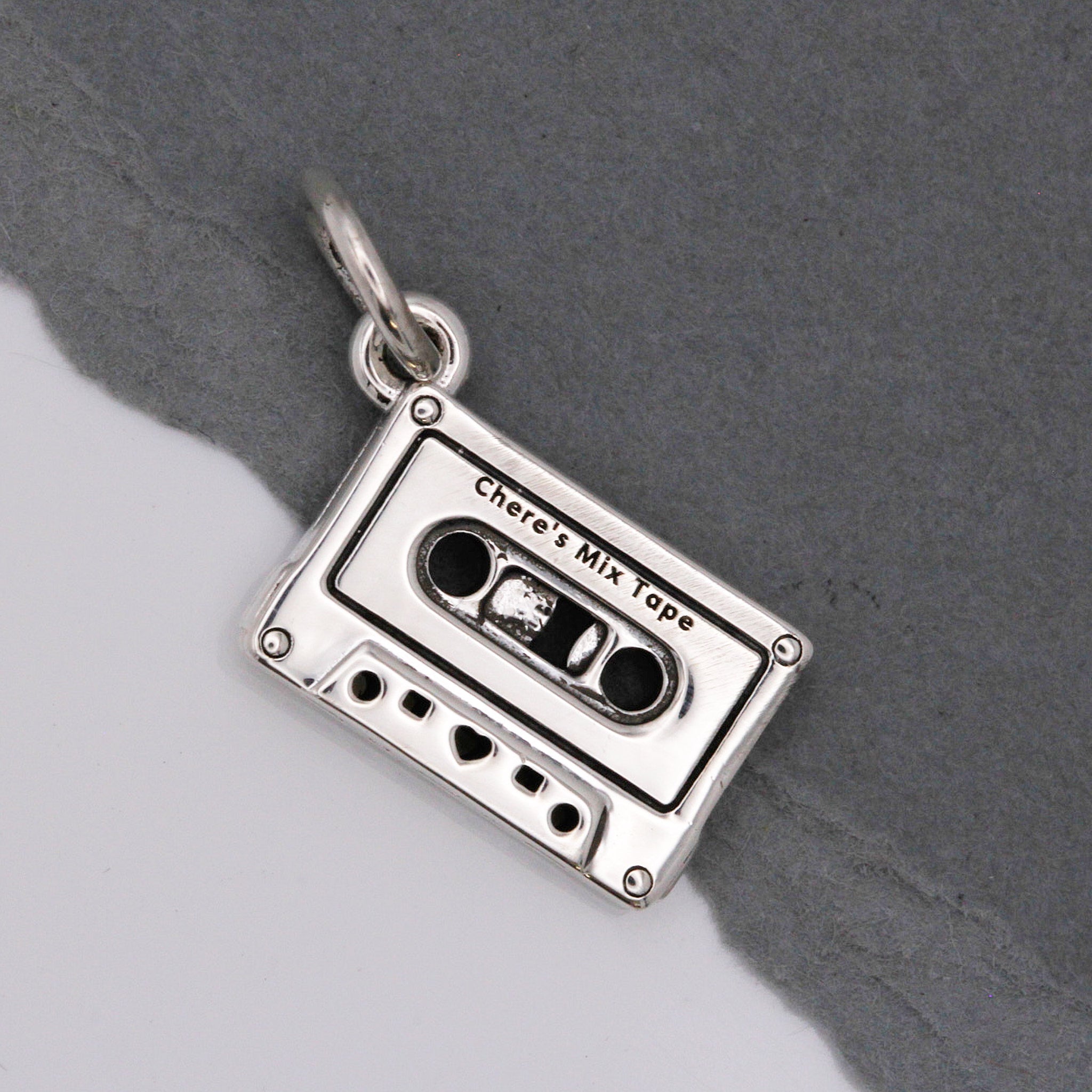 Bedel in de vorm van een cassettebandje