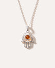 Piccolo ciondolo Hamsa in ambra